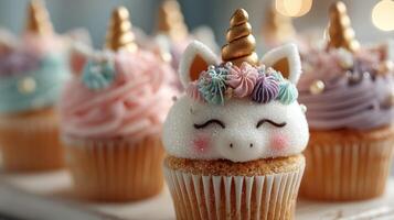 Colorful cupcakes with unicorn designs and decorative icing in a cozy bakery setting photo