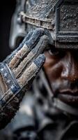 Soldier saluting with frozen gloves in a cold environment on a winter day photo