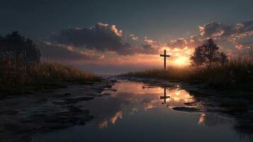 Beautiful sunset over a serene lake with a cross silhouette reflecting in calm water photo