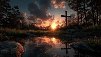 Sunset reflection over a tranquil pond with a cross in a serene forest setting photo