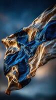 Finland flag waving in the breeze against a moody sky during twilight photo
