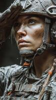 Soldier saluting with determination in a rugged environment during a challenging mission photo