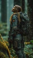 Wilderness explorer stands among trees with a tactical backpack in a misty forest during daylight photo