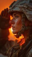 Female soldier salutes during sunset in military uniform showcasing strength and dedication photo