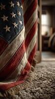 Vintage American flag draped in cozy interior setting during soft afternoon light photo