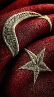 Close-up view of intricate embroidery on Turkish national flag showcasing rich details and craftsmanship photo