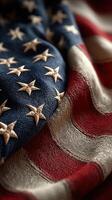 Textured fabric of American flag draped elegantly with detailed star and stripe design during daylight photo