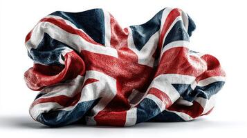 Crumpled fabric showcasing the UK flag in vibrant colors and intricate design displayed against a white backdrop photo