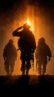 Soldiers saluting against a backdrop of an illuminated flag at sunset in a moment of remembrance and honor photo
