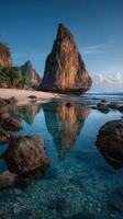 Stunning coastal landscape with rocky formations and calm waters during a clear day photo