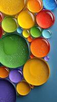 Colorful droplets on a blue surface create a vibrant and visually striking arrangement showcasing various hues and reflections photo