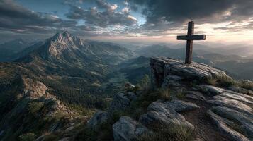 Cross on mountain peak at sunset with breathtaking landscape in background photo