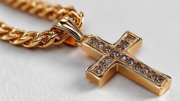 Gold cross pendant adorned with sparkling stones on a textured surface highlighting craftsmanship and elegance photo
