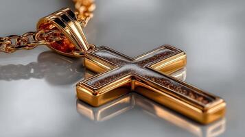 Elegant gold cross pendant showcased against a soft, reflective background enhancing its intricate design and craftsmanship photo