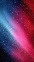 Colorful abstract design featuring vibrant shades of blue, pink, and red with particles resembling a cosmic scene at night photo