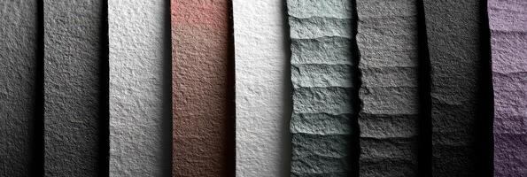 Colorful textured paper displays arranged vertically in an artistic composition showcasing various shades photo
