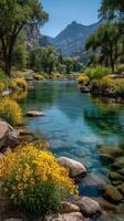 Sparkling river flows through a vibrant landscape with lush greenery and blooming flowers in serene afternoon light photo