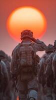 Soldiers marching at dusk with a vibrant sunset in the background creating a silhouette effect photo