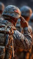 Soldier saluting during evening ceremony at military base photo
