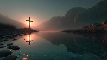 Sunset reflection behind a cross near a tranquil river in a mountainous landscape photo
