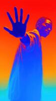 Vibrant silhouette of a person reaching out against a colorful gradient background photo