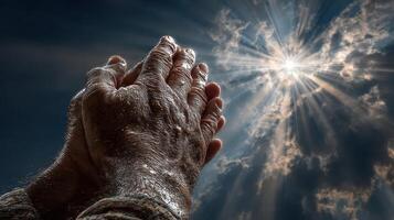 Captivating moment of prayer under radiant sunlight with hands clasped in hope and gratitude photo