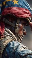 Soldier performing a salute while wearing a worn military uniform and helmet decorated with national colors photo