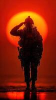 Soldier saluting at sunset with water droplets highlighting dedication and sacrifice during a quiet moment photo