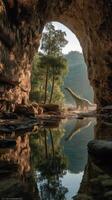 Majestic dinosaur emerges from misty waters beneath a grand stone arch in a tranquil valley landscape photo