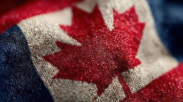 Close-up view of a Canadian flag showcasing vivid colors and detailed fabric texture, representing national pride in Canada photo