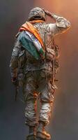 Soldier saluting with an Indian flag draped over his shoulder at sunrise photo