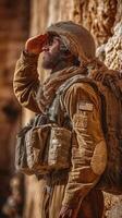 Soldier saluting at a historic site during a military exercise in the afternoon light photo