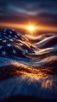 Sunset illuminating an American flag draped across waves of fabric in a serene landscape photo
