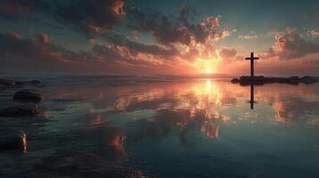 Sunset reflections with a cross over calm water in a serene landscape near the shore photo
