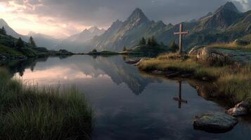 Serene mountain landscape with reflective lake and wooden cross at sunset in a tranquil setting photo