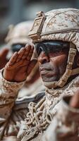 Soldiers salute during military ceremony in desert environment showing dedication and respect for service members photo