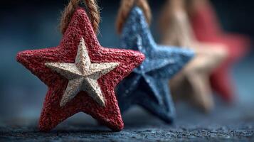 Decorative star ornaments in red, white, and blue hang against a dark background, creating a vibrant festive display photo