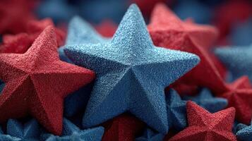 Bright red and blue textured stars scattered across a soft surface, perfect for decorations or crafts photo