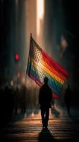 Colorful flag waves in the sunlight as a person walks through a bustling city street during a vibrant celebration photo