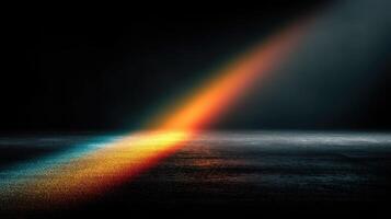Colorful light beam illuminates a dark surface, creating a vivid spectrum of colors in a dramatic setting photo