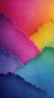 Colorful layers of torn paper create a vibrant abstract landscape in shades of purple, blue, and yellow photo