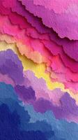 Colorful layers of paper create a vibrant abstract landscape in shades of pink, yellow, and blue photo