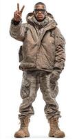 Military personnel stands confidently in tactical gear, symbolizing peace with a gesture in a studio setting photo