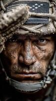 Soldier displaying determination and resilience in intense conditions during a military operation in a rugged environment photo