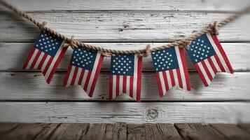 Festive decoration featuring multiple American flags hanging on rustic wooden backdrop for celebration photo