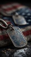 Military dog tags displayed on a worn flag, highlighting the bond between service members and their country photo