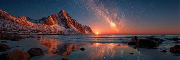 Stunning landscape at twilight with mountains, ocean, and stars illuminated by the setting sun in Norway photo