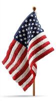 Waving fabric American flag on a wooden stick with vivid colors and detailed texture in a clear background photo