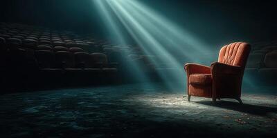 Lonely vintage chair illuminated by rays of light in an empty theater during a quiet evening photo