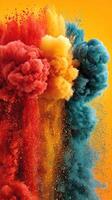 Colorful smoke clouds blend together in vivid patterns against a bright yellow background, creating an artistic display of color photo